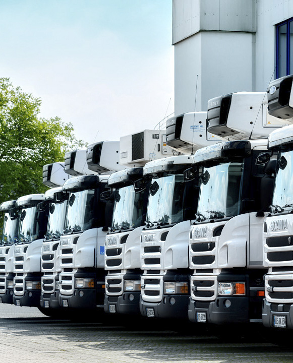 Fleet of commercial delivery trucks – industrial photography by Roman Kasperski